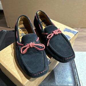 Navy suede loafers with red details